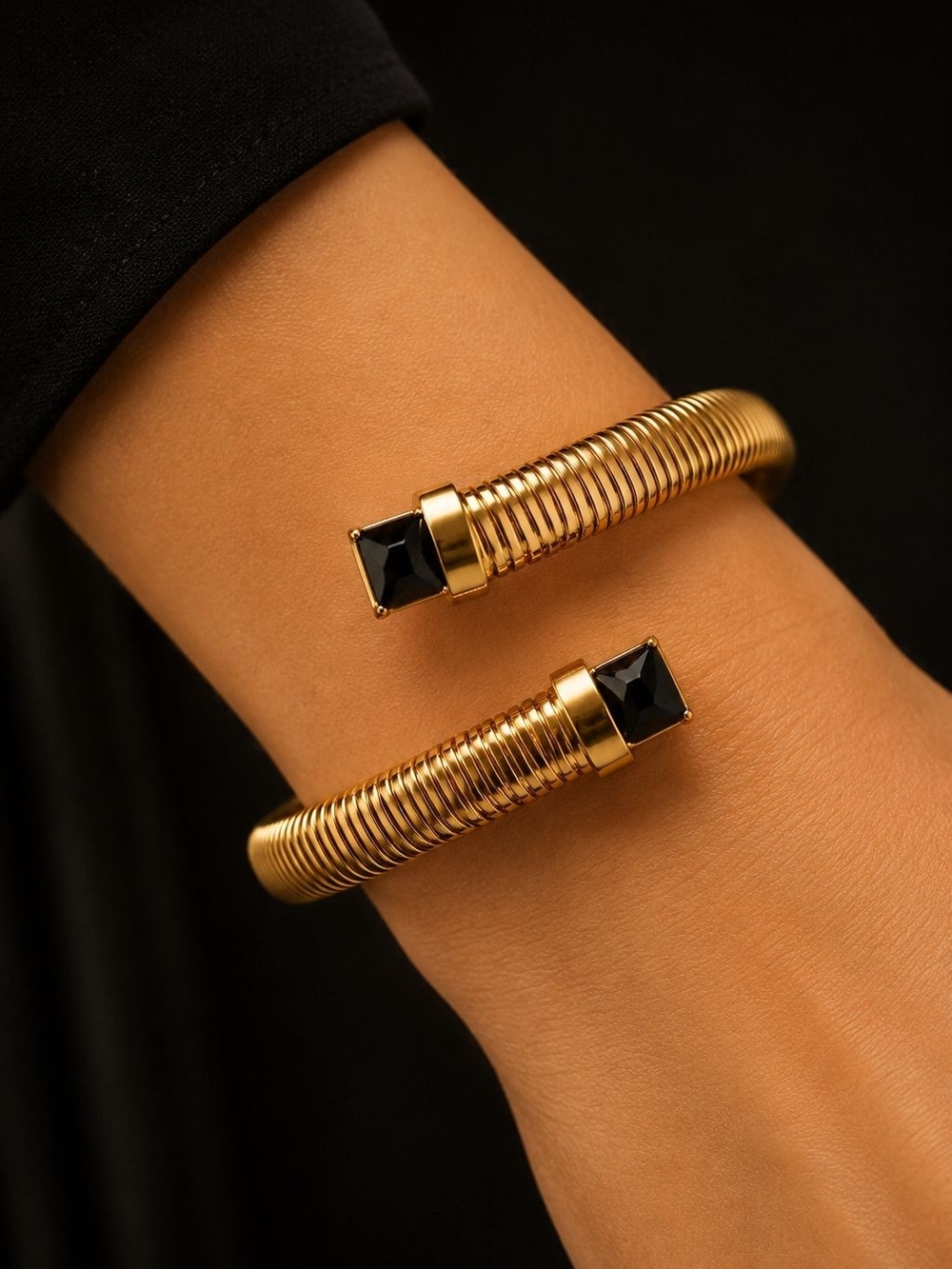 Gold Coiled Cuff Bracelet with Black Stone Ends